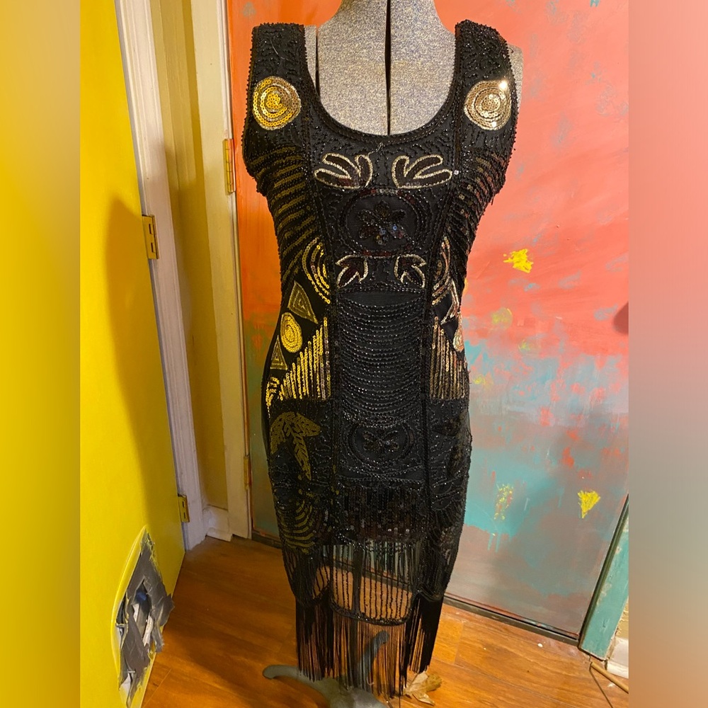 Hand beaded dress.  A head turner